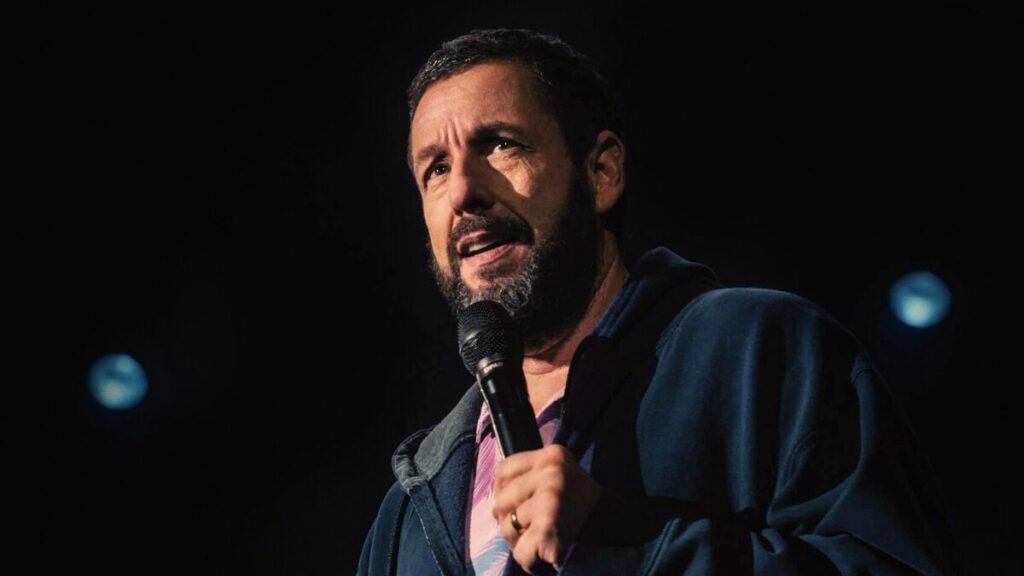 Adam Sandler on set of a Netflix film, symbolizing his exclusive multi-million dollar deal with the streaming giant.