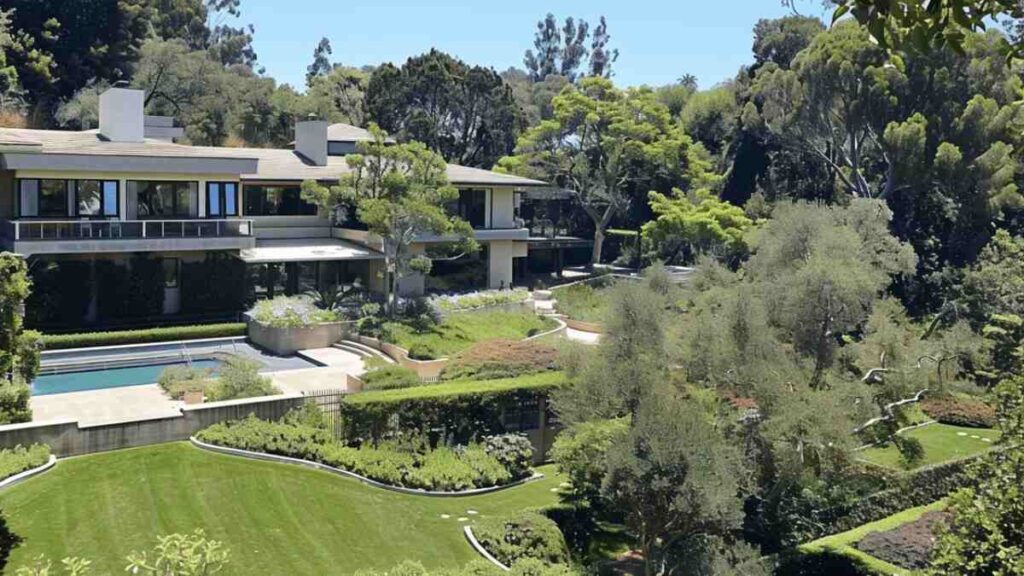 Exterior of a high-end home owned by Adam Sandler, reflecting his long-term real estate investments