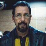 Adam Sandler in Uncut Gems, portraying Howard Ratner in a tense and dramatic scene from the film.