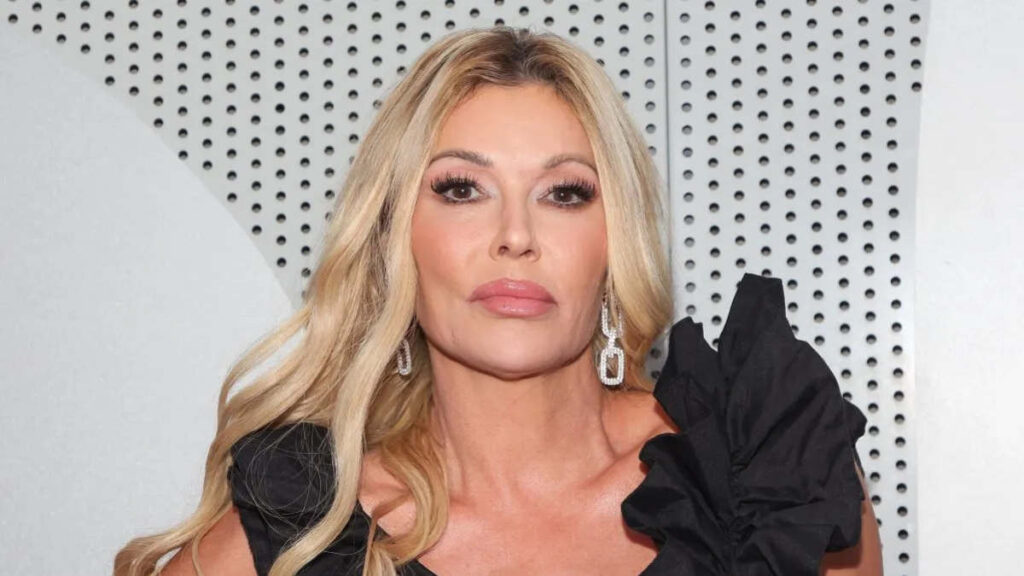 Brandi Glanville promoting her book Drinking and Tweeting during a media appearance — a key example of how Brandi Glanville monetized controversy through personal storytelling and bold branding.