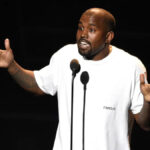 Kanye West performing on stage during the 808s & Heartbreak tour, a defining moment in Kanye West career