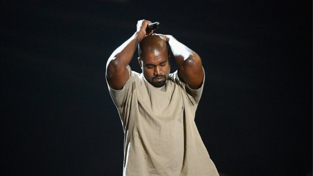 Kanye West provocation during a live performance, making a bold statement that sparks media attention and public debate.