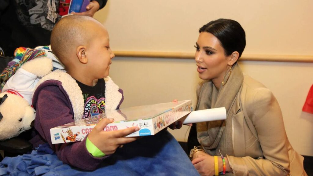 Kim Kardashian speaking at a criminal justice reform event, highlighting her philanthropy and advocacy for prison reform.