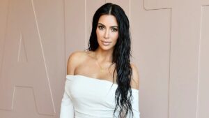 Kim Kardashian using social media to engage fans through Instagram posts and stories, showcasing her personal brand and lifestyle.