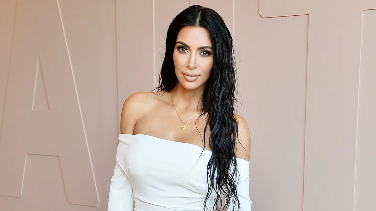 Kim Kardashian using social media to engage fans through Instagram posts and stories, showcasing her personal brand and lifestyle.
