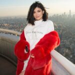 Kylie Jenner at a brand event representing the growth of the Kylie Jenner Empire, showcasing her role as a beauty mogul and entrepreneur.