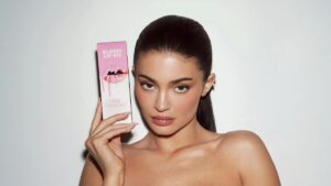 Kylie Jenner promoting Kylie Cosmetics Lip Kits with signature packaging and glam aesthetic