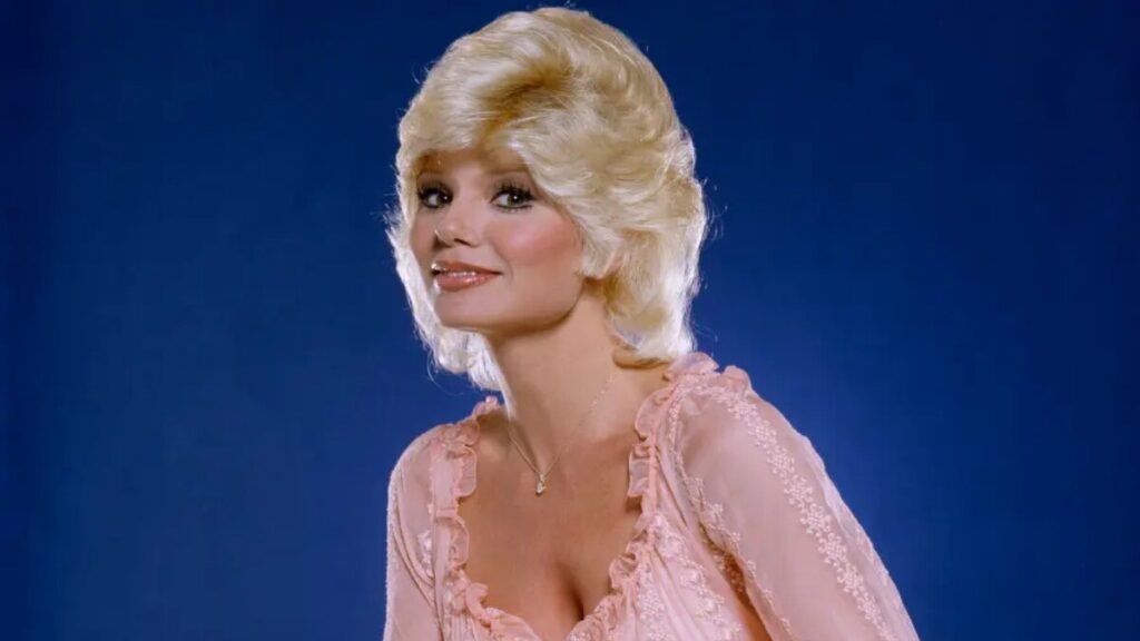 Loni Anderson as Jennifer Marlowe on WKRP in Cincinnati, representing the evolution of the attractive secretary trope in classic TV sitcoms – a key example in discussions of Loni Anderson TV Tropes
