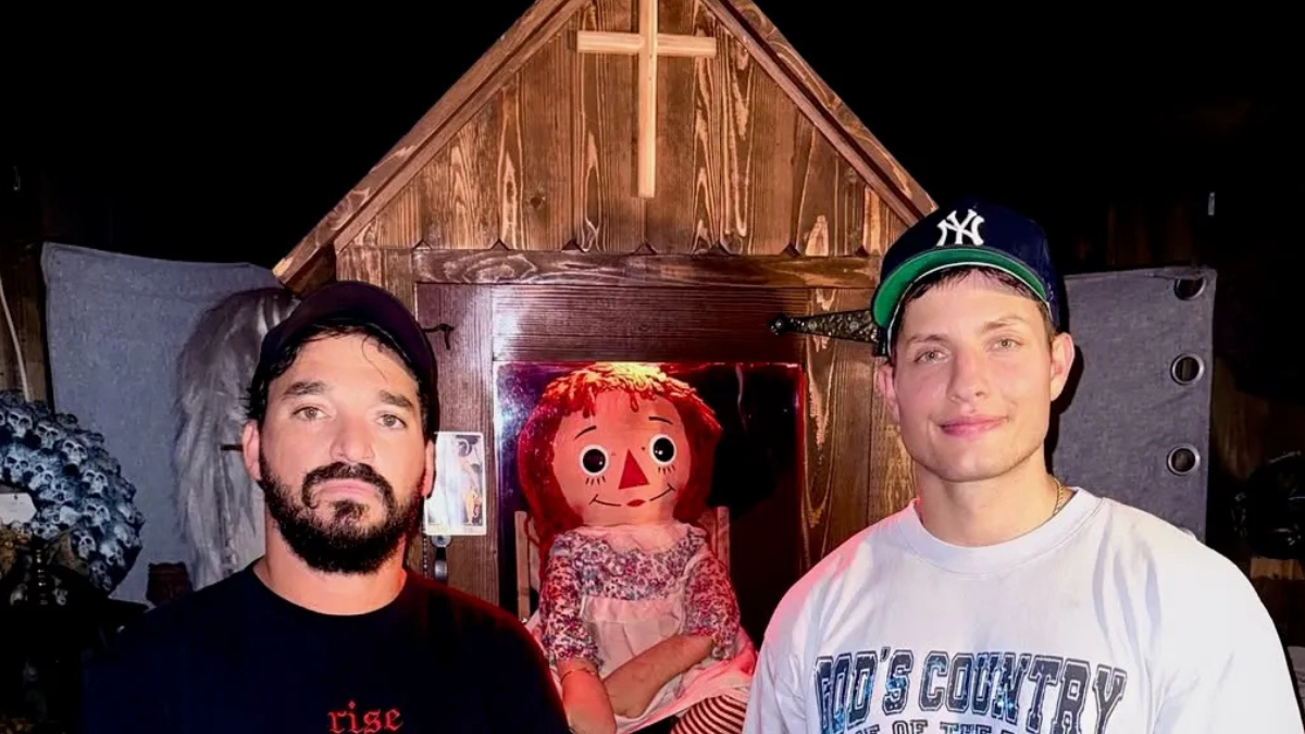 Matt Rife standing in the Annabelle Doll House he recently purchased, blending comedy with paranormal branding.