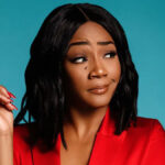 Tiffany Haddish posing confidently in a stylized photo shoot for “Changing Hollywood’s Voice,” symbolizing her impact on representation and authenticity in the entertainment industry.