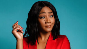 Tiffany Haddish posing confidently in a stylized photo shoot for “Changing Hollywood’s Voice,” symbolizing her impact on representation and authenticity in the entertainment industry.