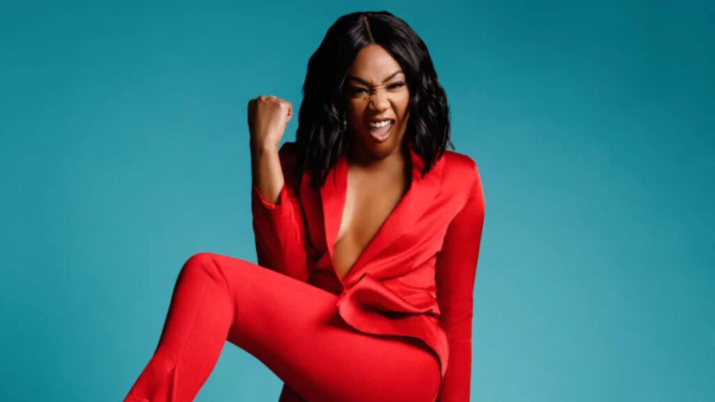 Tiffany Haddish on red carpet appearing serious, reflecting the emotional and financial impact of public controversies in her career – The Cost of Fame