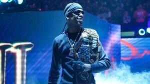 Travis Scott performing on stage with signature dark, surreal lighting and visual effects—capturing the core of his aesthetic.