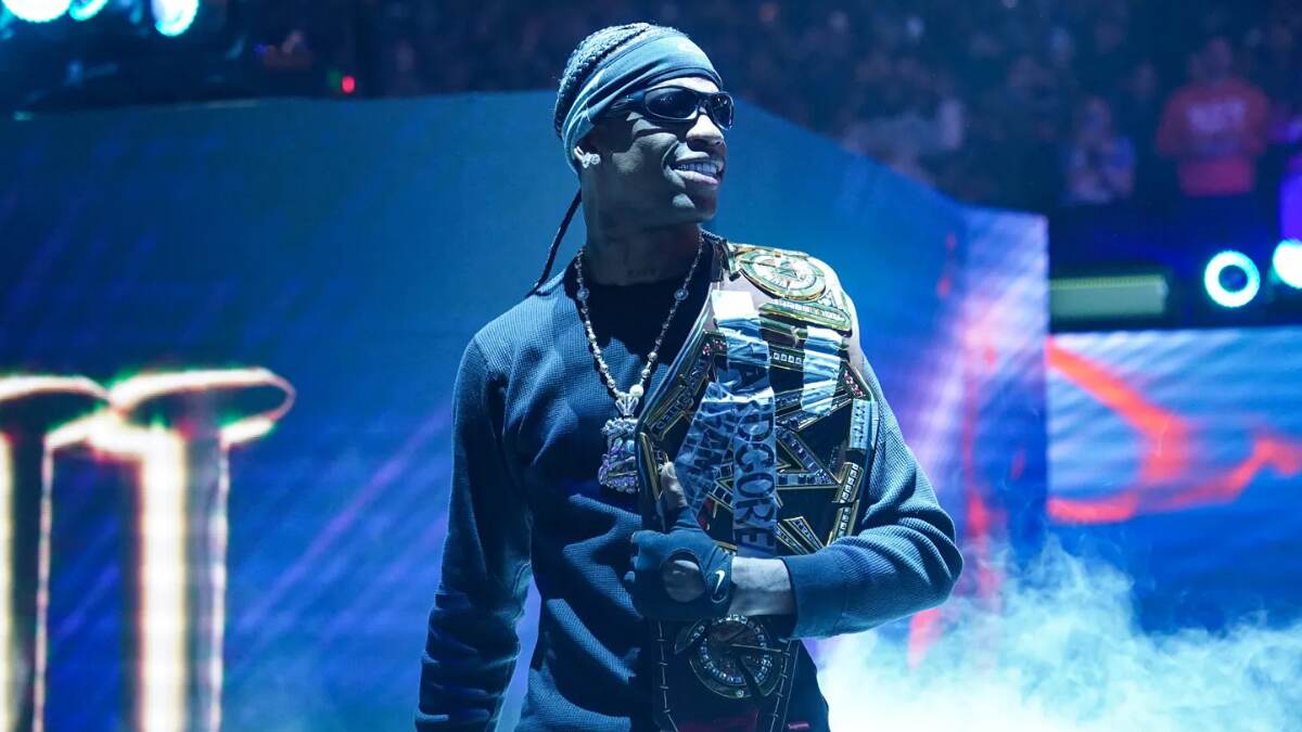 Travis Scott performing on stage with signature dark, surreal lighting and visual effects—capturing the core of his aesthetic.