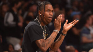Travis Scott with Cactus Jack Nike sneakers, showcasing the commercial impact of his legacy