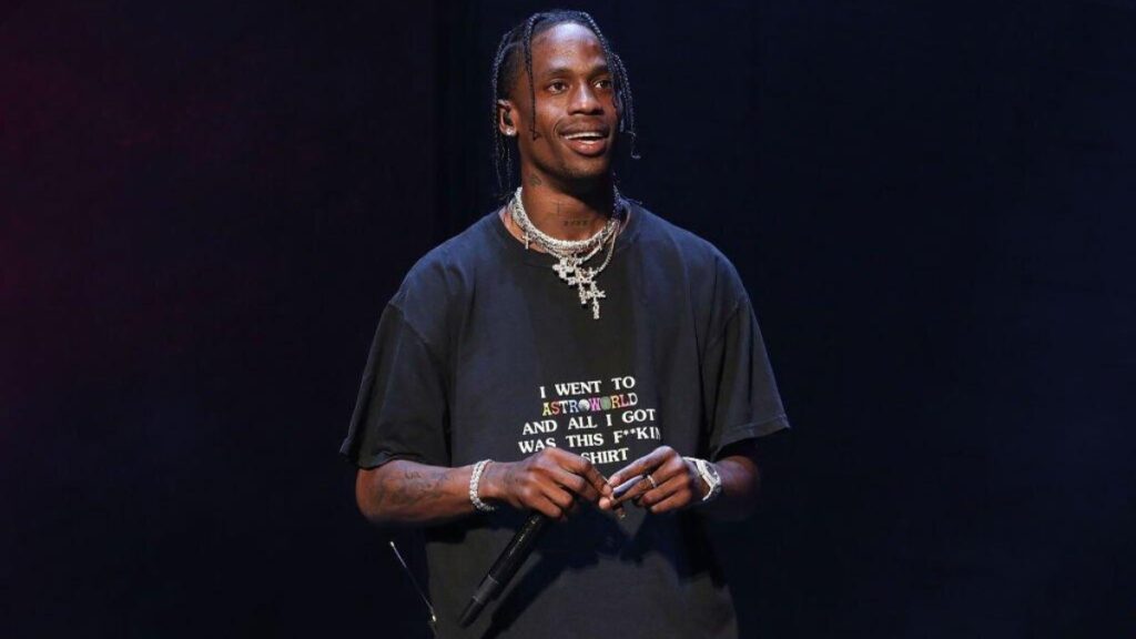 Travis Scott performing live on stage with high production visuals, symbolizing Travis Scott legacy on the line after Astroworld and Utopia.