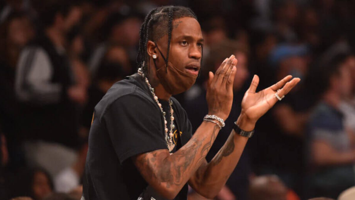 Travis Scott with Cactus Jack Nike sneakers, showcasing the commercial impact of his legacy