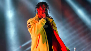Travis Scott standing on stage during concert, representing his multimillion-dollar music and brand empire — Travis Scott net worth