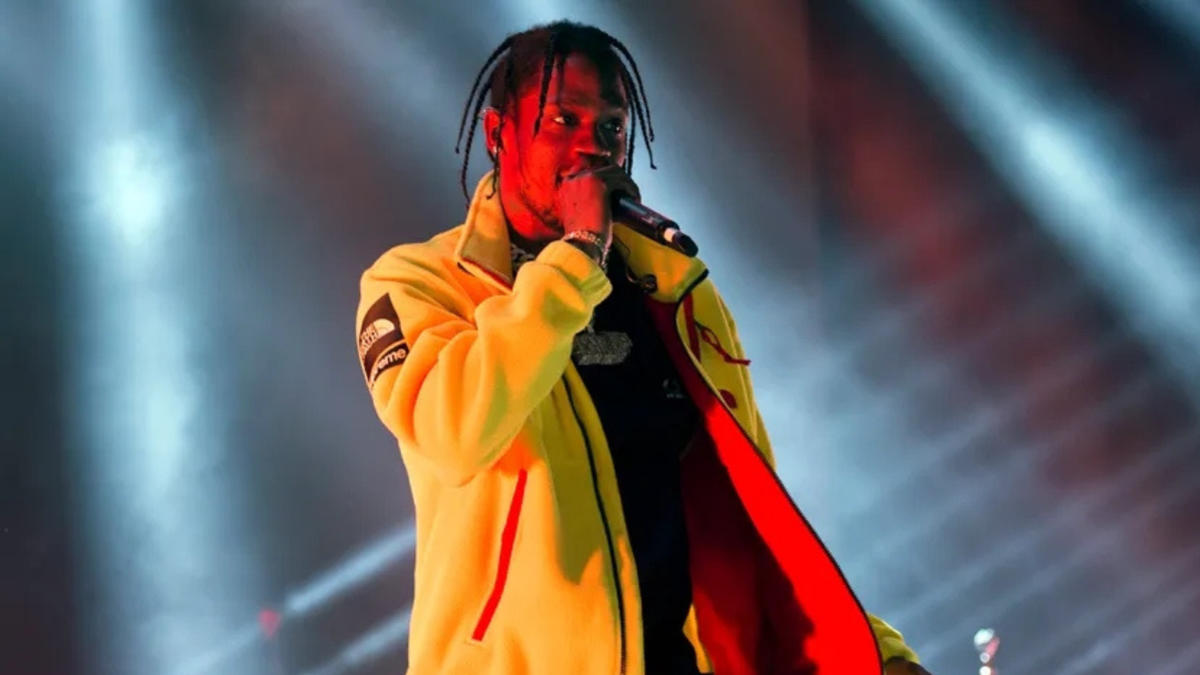 Travis Scott standing on stage during concert, representing his multimillion-dollar music and brand empire — Travis Scott net worth