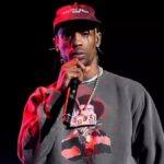 Travis Scott performing live during his Astroworld Tour, symbolizing his rise and reinvention as a global music icon.