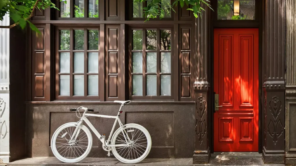 Claire Danes Greenwich Village townhouse exterior with historic red-brick design and classic New York brownstone charm.