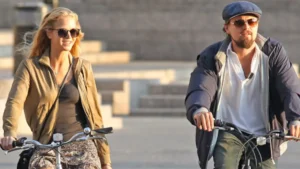 Erin Heatherton and Leonardo DiCaprio on cycle during 2012 outing in New York City, photographed together as a celebrity couple.