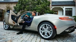 Tom Brady cars collection featuring Bugatti Veyron, Aston Martin, Rolls-Royce, and Cadillac Escalade
