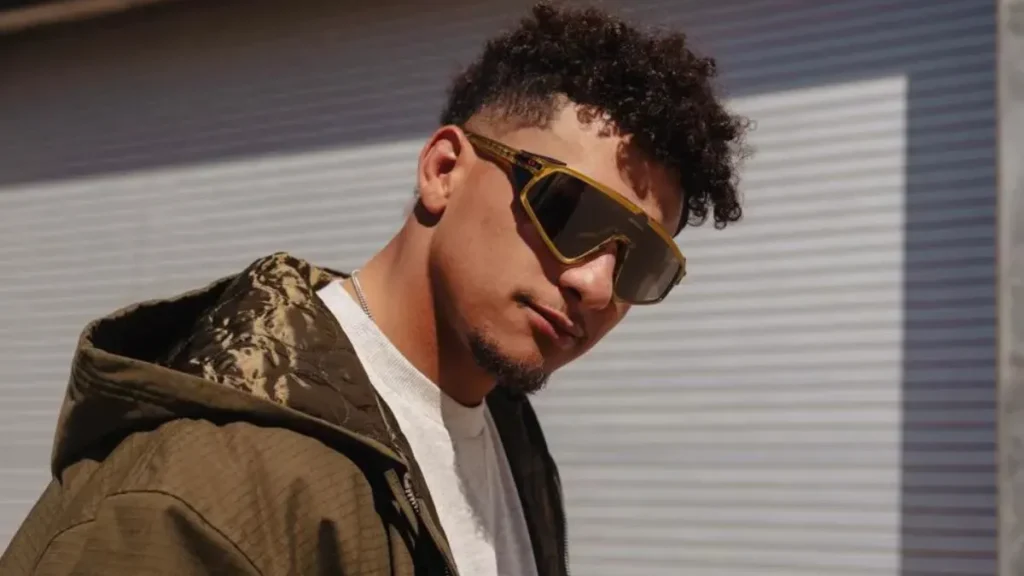 Patrick Mahomes Fashion & Signature Style featuring luxury sneakers, Cartier watch, and Louis Vuitton outfit