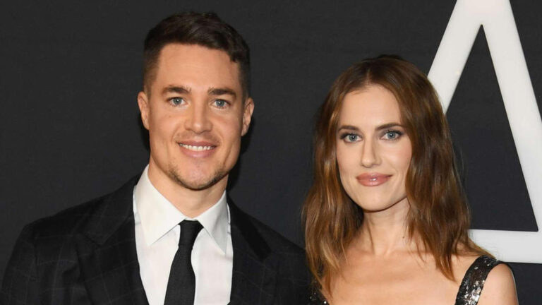 Allison Williams and Alexander Dreymon standing side by side, smiling warmly, Allison in an elegant white dress and Alexander in a tailored suit, confirming their marriage.