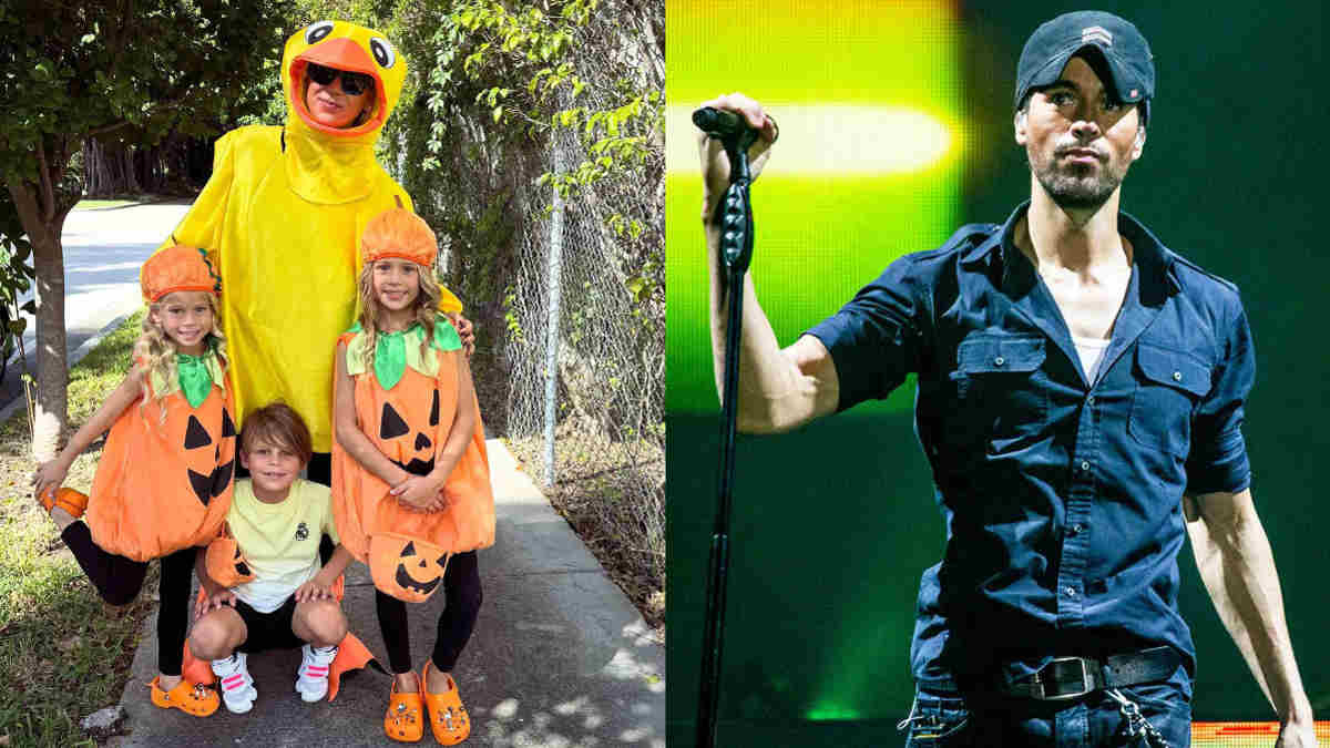 Pregnant Anna Kournikova smiling with her children in Halloween costumes.