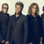 Poster image showing Jon Bon Jovi in leather jacket holding a microphone, text overlay reads ‘Bon Jovi: The Triumphant Tour Return.