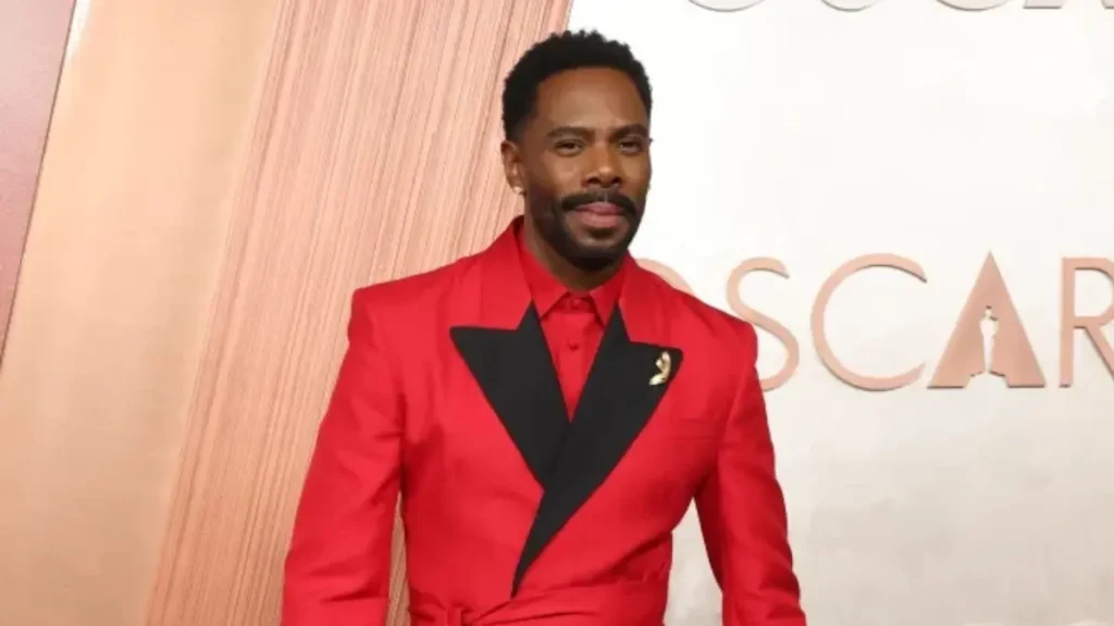 Colman Domingo waves to fans at a film premiere, midnight tuxedo, 2025