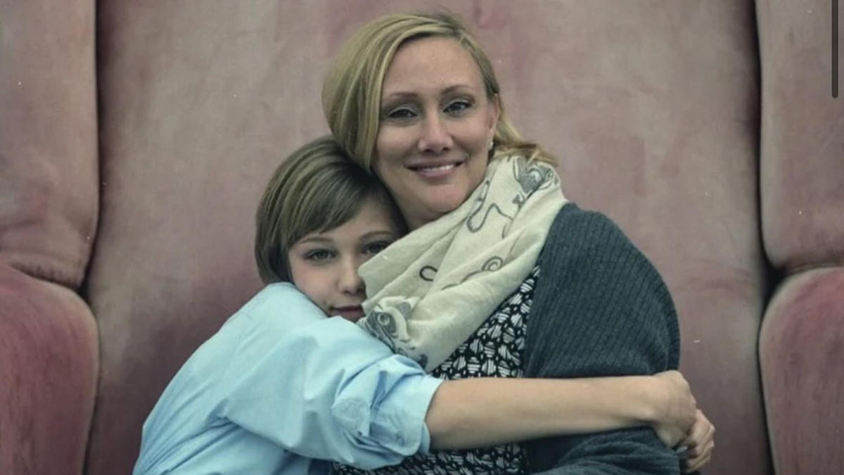 Grace VanderWaal posing with her mother at a public event, both smiling and dressed elegantly for the occasion.