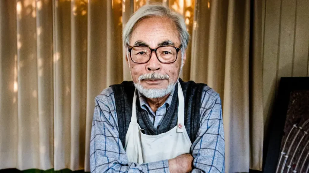 Projector booth view as a remastered Hayao Miyazaki feature rolls in IMAX