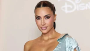 Kim Kardashian attending an event in a sleek outfit, appearing confident and healthy under bright lights.