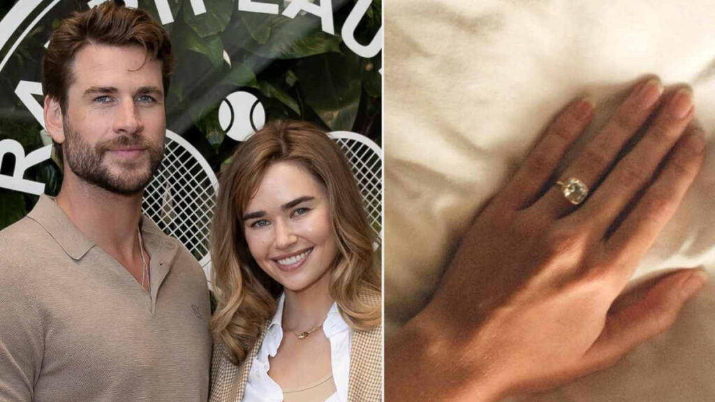 Liam Hemsworth proposing to Gabriella Brooks outdoors, with her engagement ring visible as she admires the gesture in a moment of joy.
