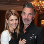 Mossimo Giannulli and Lori Loughlin pose together at a red carpet event