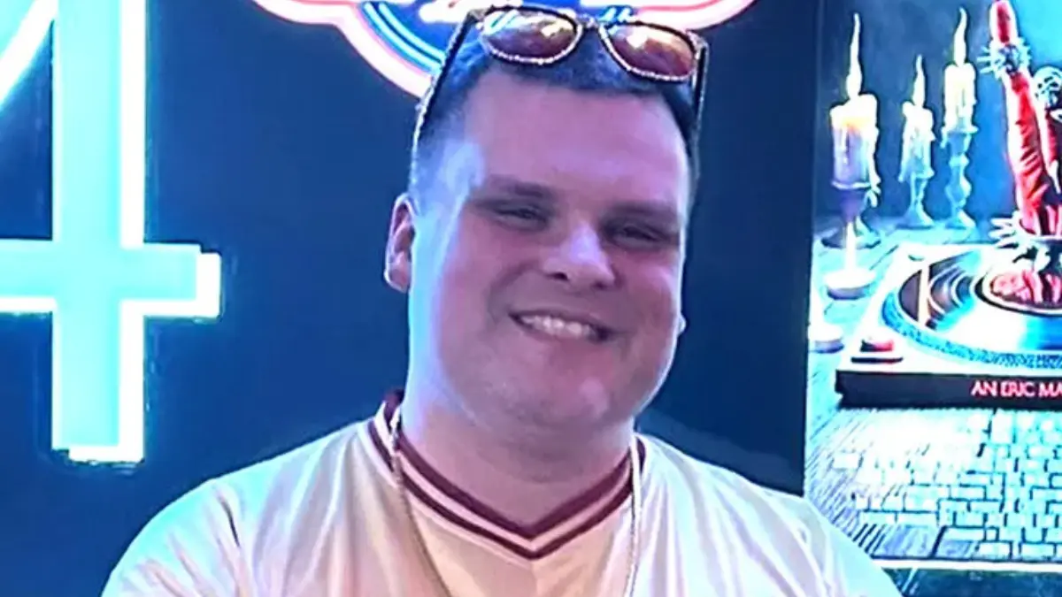 Steve Bridges smiling softly in a close-up portrait, natural window light, 2025.